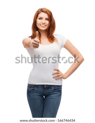 t-shirt design and happy people concept - smiling teenager in blank white t-shirt showing thumbs up