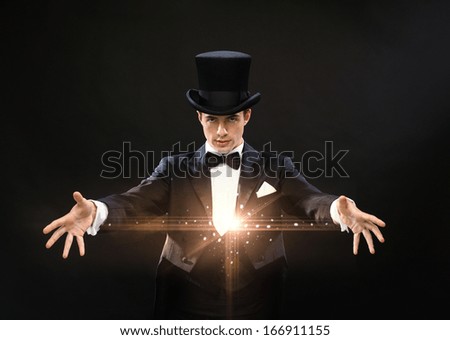 Magic, Performance, Circus, Show Concept - Magician In Top Hat Showing Trick