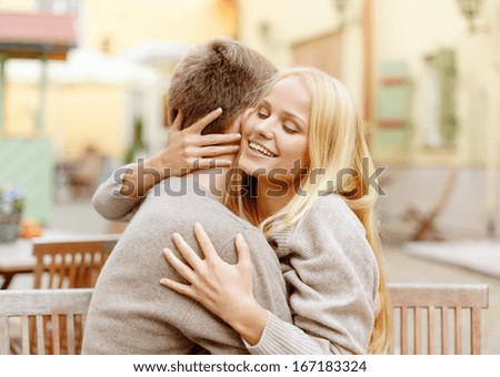 Summer Holidays, Love, Travel, Tourism, Relationship And Dating Concept - Romantic Happy Couple Hugging In The Cafe