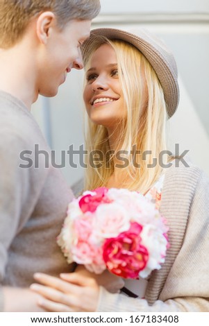 Summer Holidays, Love, Relationship And Dating Concept - Happy Couple With Bouquet Of Flowers In The City