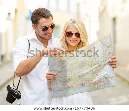 Summer Holidays, Dating And Tourism Concept - Smiling Couple In Sunglasses With Map In The City