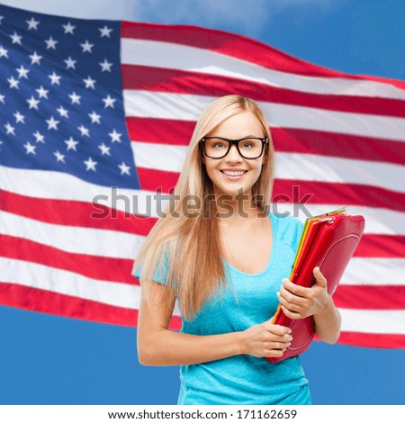 school, travel, tourism and education concept - smiling student with folders