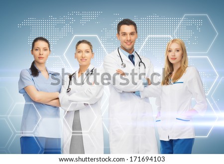 Healthcare And Medicine Concept - Young Team Or Group Of Doctors