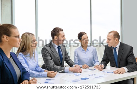 business and office concept - smiling business team at meeting