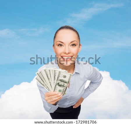 business, money and banking concept - smiling businesswoman with dollar cash money