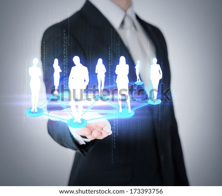 social and business concept - close up of mans hand showing social or business network