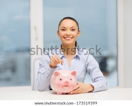 banking and finances concept - lovely woman with piggy bank and cash money