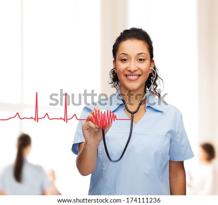 Healthcare And Medicine Concept - Smiling Female African American Doctor Or Nurse With Stethoscope