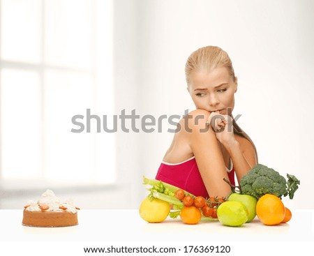 fitness, diet, health and food concept - doubting woman with fruits and pie