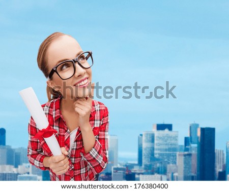 university and education concept - smiling woman in black eyeglasses with diploma