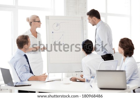 smiling business team discussing something in office