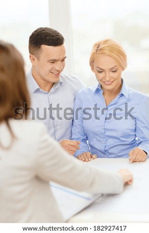 finance, bank, family and business concept - smiling couple at bank