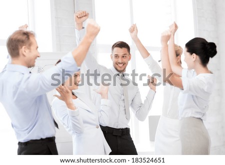 business concept - picture of happy business team celebrating victory in office