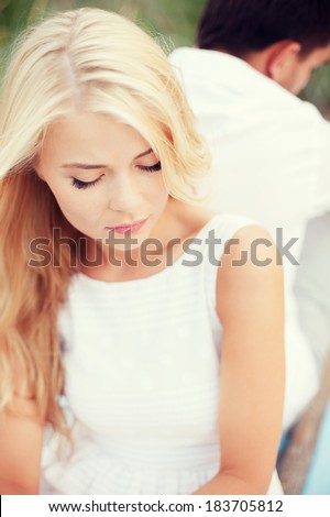 dating and relationships concept - stressed woman with man outside