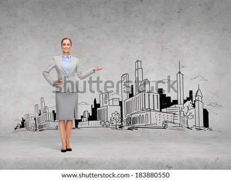 business and advertisement concept - smiling young businesswoman showing town sketch