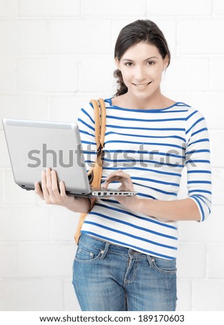 education and technology concept - picture of happy teenage girl with laptop computer