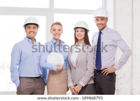 business, architecture and office concept - happy team of architects in office