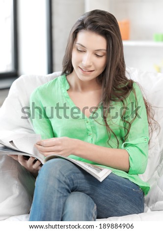 bright picture of happy and smiling woman with magazine