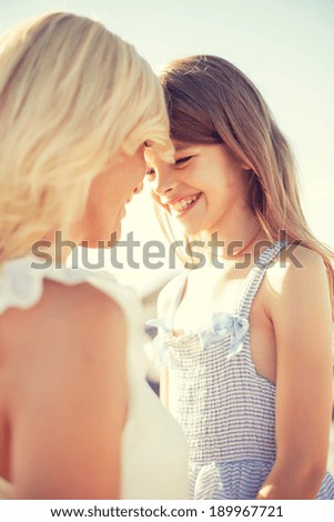 summer holidays, family, children and people concept - happy mother and child girl
