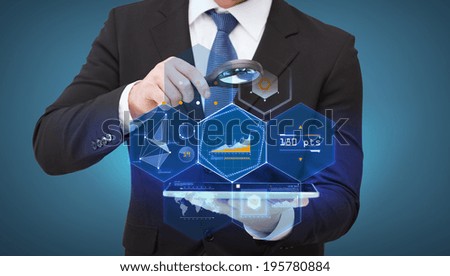 technology, internet and business concept - businessman holding magnifying glass over tablet pc computer
