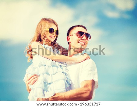 summer holidays, children and people concept - happy father and child in sunglasses over blue sky