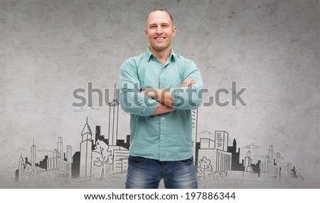 happiness and people concept - smiling man with crossed arms and city drawing in the back