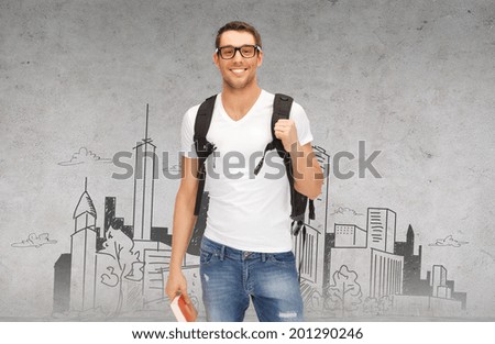education, travel and vacation concept - smiling student in eyeglasses with backpack and book in front of city sketch