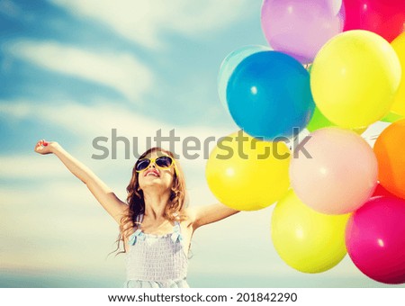 summer holidays celebration family children and people concept happy girl with colorful balloons summer holidays celebration family children and people concept happy girl with colorful balloons