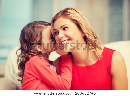 picture of mother and daughter whispering gossip