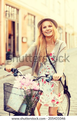 summer holidays, bikes, travel concept - attractive woman in hat with bicycle in the city