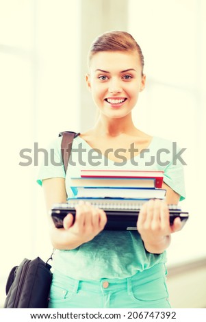 education concept - smiling student with folders and school bag in college