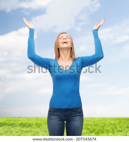 happiness and people concept - laughing young woman with closed eyes waving hands