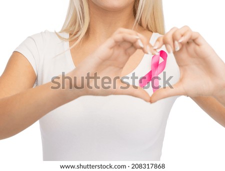 healthcare and medicine concept young woman in blank white t-shirt with pink breast cancer awareness ribbon showing heart shape healthcare and medicine concept young woman in blank white t-shirt with pink breast cancer awareness ribbon showing heart shape