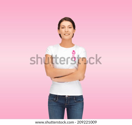 healthcare support people and medicine concept smiling woman in blank white t-shirt with breast cancer awareness ribbon over pink background healthcare support people and medicine concept smiling woman in blank white t-shirt with breast cancer awareness ribbon over pink background