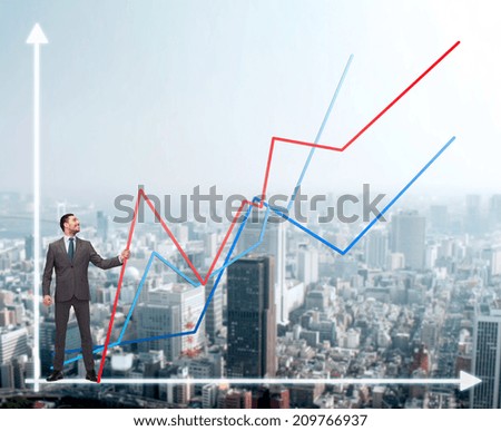 business, development and people concept - smiling man holding graph line over chart and cityscape background