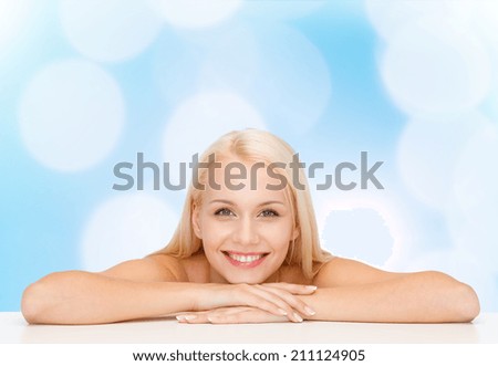 health and beauty concept - closeup of clean face and shoulders of beautiful young woman