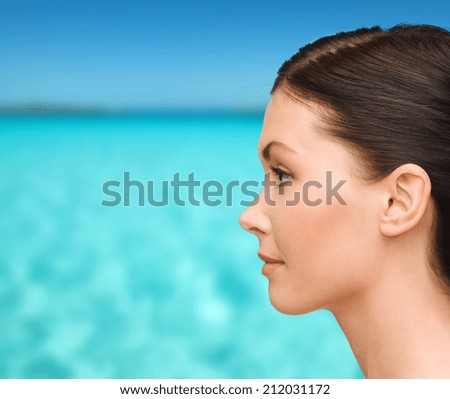 beauty and health concept - profile portrait of young woman