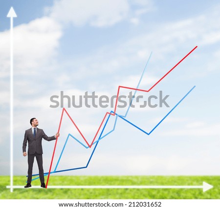 business, development and people concept - smiling man holding graph line over chart background