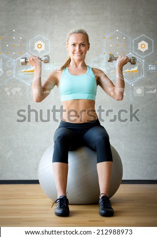 fitness, sport, training, future technology and lifestyle concept - smiling woman with dumbbells and exercise ball in gym and graph projection