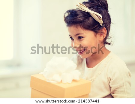 holidays, presents, christmas,  birthday concept - happy child girl with gift box