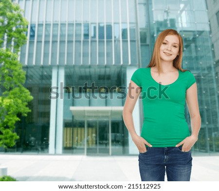 happiness, advertisement, business, education and people concept - smiling teenage girl in casual clothes over campus background