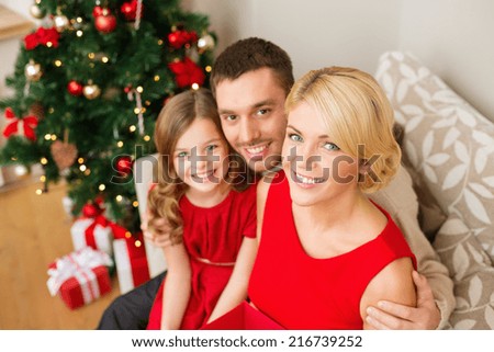 family, christmas, x-mas, happiness and people concept - happy family at home