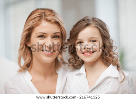 bright closeup picture of mother and daughter