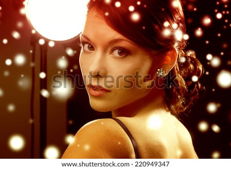 luxury, vip, nightlife, party, christmas, x-mas, new year\'s eve concept - beautiful woman in evening dress wearing diamond earrings