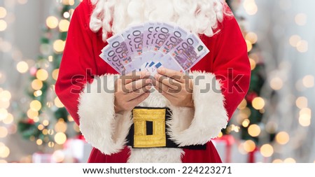 christmas, holidays, winning, currency and people concept - close up of santa claus with euro money over tree lights background