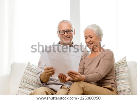 family, business, age and people concept - happy senior couple with papers at home