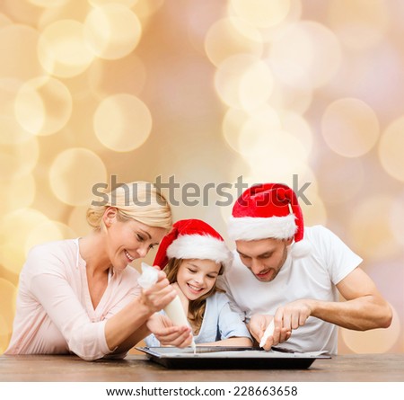 food, family, christmas, happiness and people concept - smiling family in santa helper hats with glaze and pan cooking over beige lights background