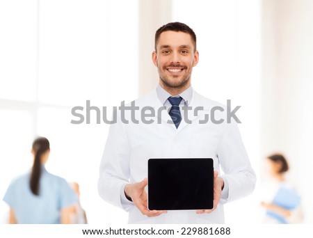 medicine, profession, and healthcare concept - smiling male doctor with tablet pc computer