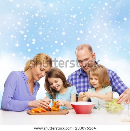 food, family, children, happiness and people concept - happy family with two kids making dinner over blue sky and snowflakes background