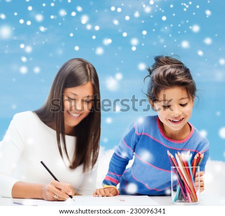 childhood, family, education and people concept - smiling little girl and mother or teacher drawing with coloring pencils over blue snowy sky with cloud background